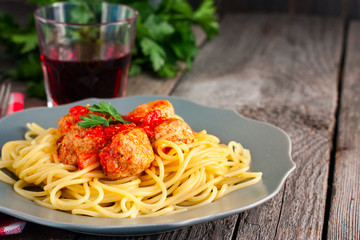 Spaghetti pasta with meatballs and tomato sauce, selective focus