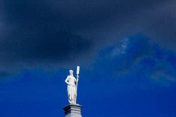 Semi-nude sculpture (monument) of a girl with a paddle with a paddle. Peter-Pavel's Fortress. Saint-Petersburg, Russia.