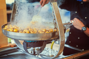 New potatoes fried in a pan with Italian recipe: potatoes salent