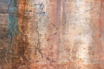 old plaster wall with rusty stains from water