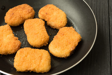 Delicious chicken nuggets cooked on vegetable oil