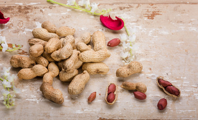 Fototapeta premium peanuts on wooden table