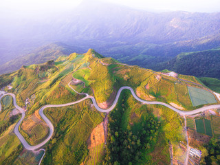 Aerial view of crooked path of road on the mountain, Shot from d