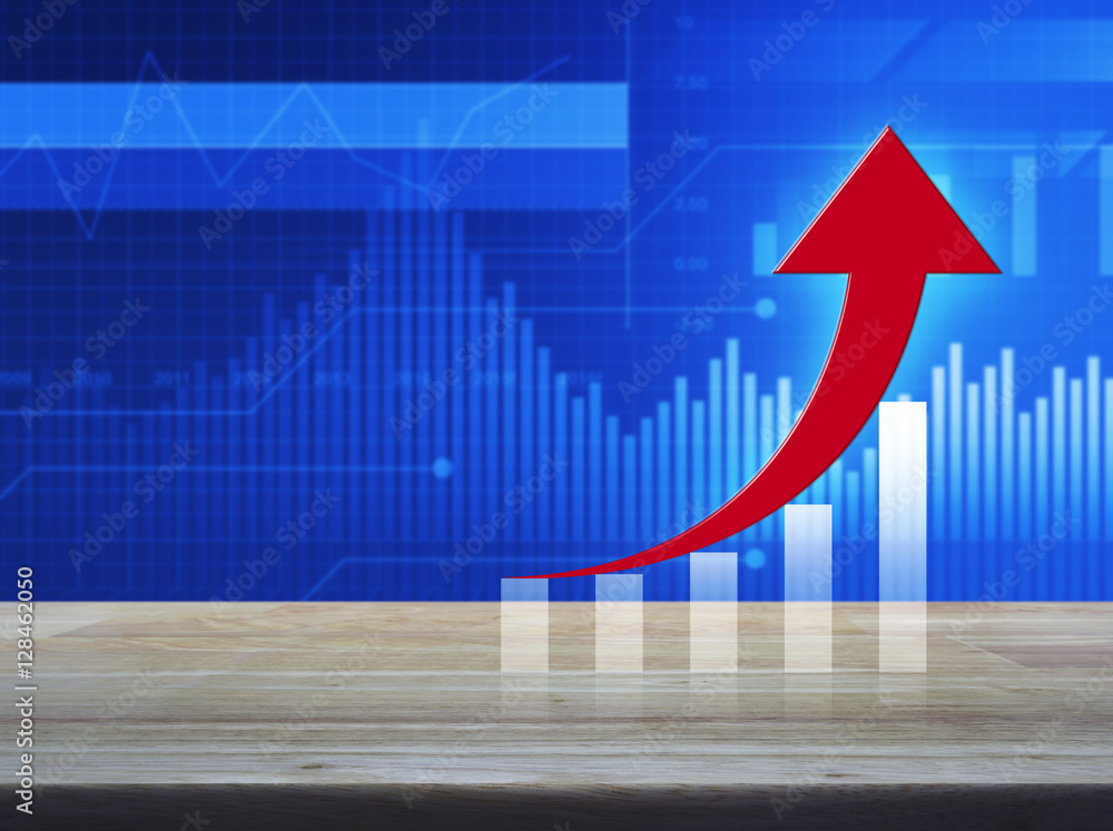Poster red arrow with graph on wooden table over financial graph