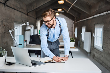 Hipster, businessman working at modern office