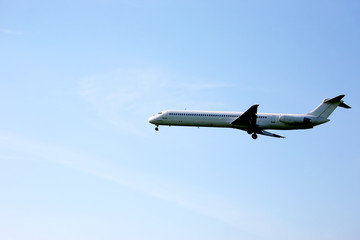passenger jet plane flying in the blue sky