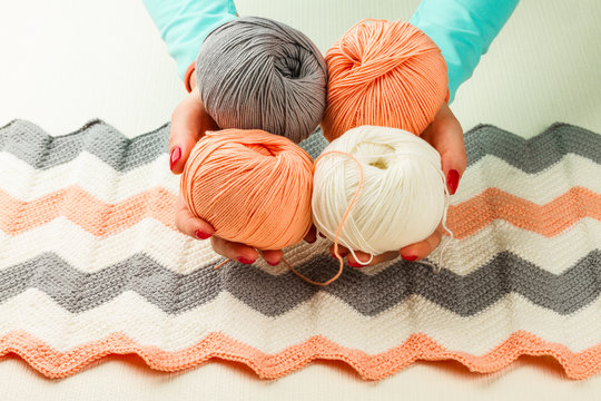 rolls of soft knitting yarn, knitting, female hands