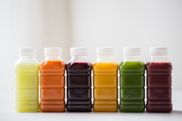 bottles with different fruit or vegetable juices