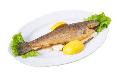 Grilled trout with melted cheese and lemons.