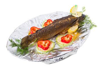 Delicious grilled trout with vegetables.