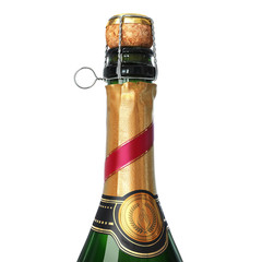 Sparkling wine bottle with red banderole and wreath label