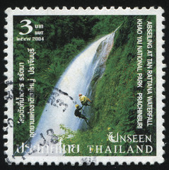 climbing on the Abseiling At Tan Rattana Waterfall