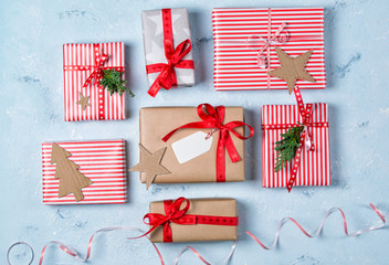 Fototapeta premium Christmas background with gift boxes and decorations, stone table, top view