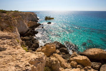 Fototapeta na wymiar Stone cliff in a beautiful blue sea Cyprus