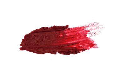 Smudged red color lipstick on background