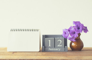 vintage wood calendar for january day 12 on wood table with empt