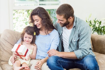 Daughter receiving surprise a gift from her parents