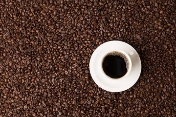 coffee beans topview fullscreen with coffee cup and copyspace