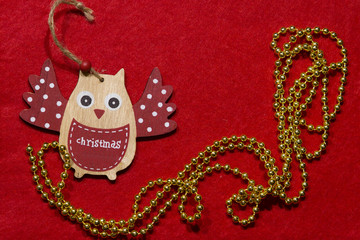 Christmas toy. Wooden owl on a tree.