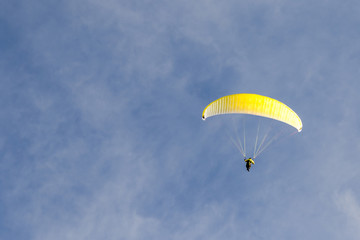 Paragliding in the blue sky