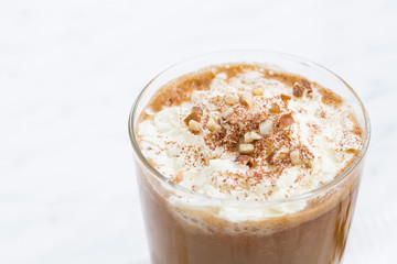 festive spiced pumpkin latte and almond cookies, closeup