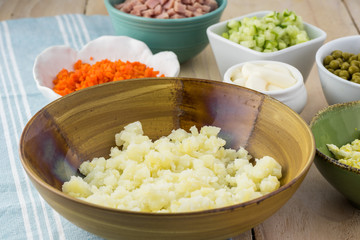 Ingredients for traditional russian olivier salad with ham veget