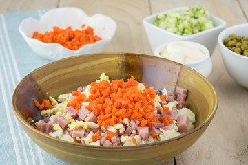 Ingredients for traditional russian olivier salad with ham veget