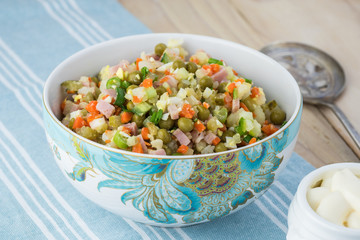 Ingredients for traditional russian olivier salad with ham veget