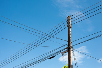Power lines and insulators with blue sky