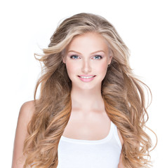 Beautiful happy woman with long curly hair.