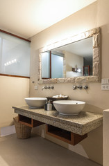 Fototapeta na wymiar Interior of a modern bathroom with twin sinks.