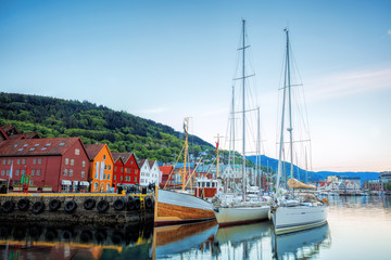 Fototapeta na wymiar Bryggen street with boats in Bergen, UNESCO World Heritage Site, Norway