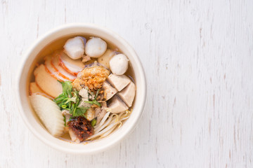 Thai Noodle , Thai Noodle meat.,Bowl of noodles with vegetables on wooden table.