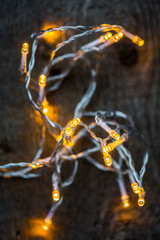 Fairy lights on dark wooden table