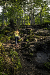 Fototapeta premium Young woman relaxing and enjoying the view on the fjord of Norwa