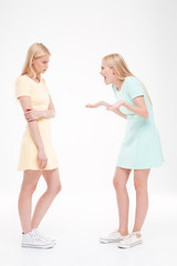 Two ladies swear over white background