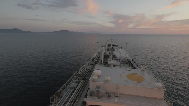 Gas tanker at sea in sunset