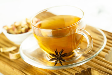 Cup of hot apple tea with spices