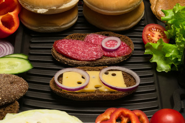 Fototapeta na wymiar two beautiful sandwich with grilled onion rings
