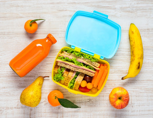 Lunch Box with Drinks, Sandwiches and Fruits