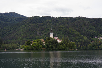 Fototapeta na wymiar Church on island in the middle of Bled lake. Slovenia
