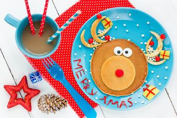 Fototapeta na wymiar Christmas fun food for kids santa reindeer pancake