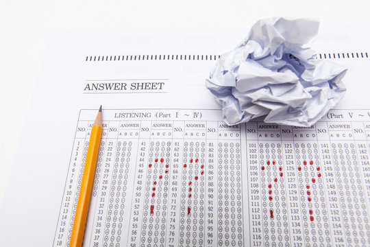 crumpled onr answer sheet and pencil on white backgrounds