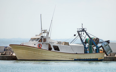 Naklejka premium Fishing vessel in the port.