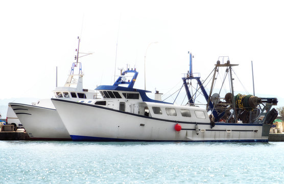 Two fishing vessels in the port.