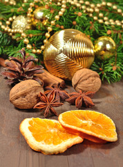Fototapeta na wymiar Different kinds of spices, nuts, cone and dried oranges, Christm