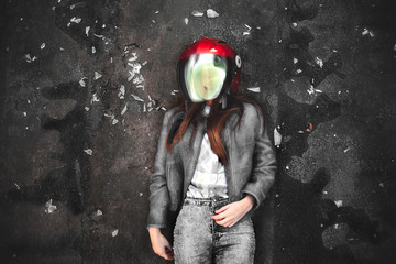 Photo of sexual biker girl in a red helmet and black jacket.