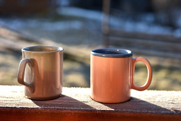 Morning coffee cups on a balcony