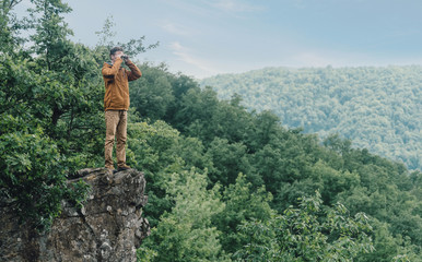 Explorer looking in binoculars