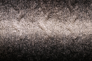The texture of warm winter wool sweater with unusual patterns.